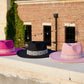 Pink, black, and fuchsia boho inspired hats for women.
