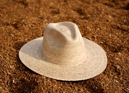 A natural color large brim palm sun hat.