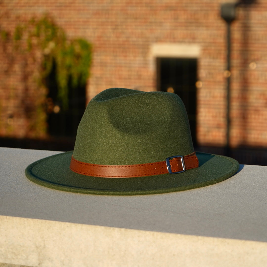 A dark green color traditional fedora with a leather buckle headband.