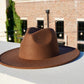 Brown wide brim fedora hat.