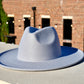 A gray color wide brim hat.