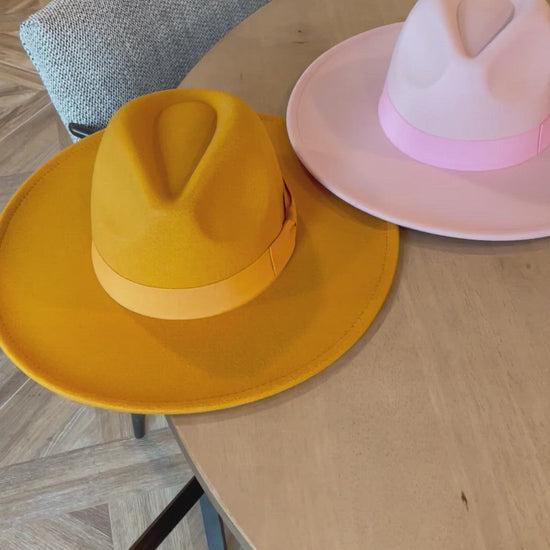 Video showing an assortment of dope hat's fedoras in various colors.